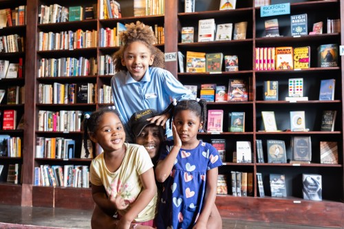 A father and his kids at Maze Books in Rockford, IL. 